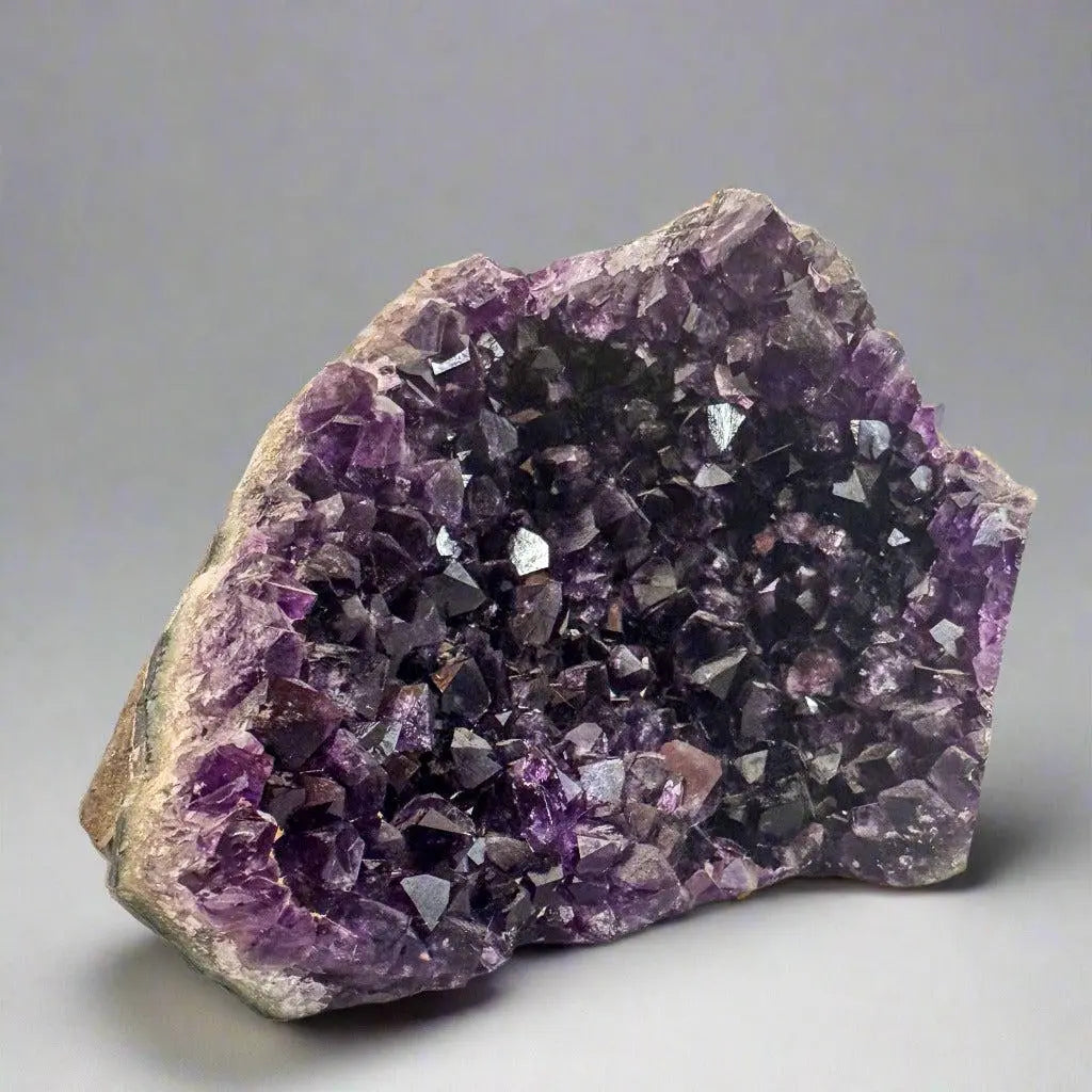 Blackbird & Sage Jewelry Studio amethyst geode decor piece with deep purple crystals and natural rough edges