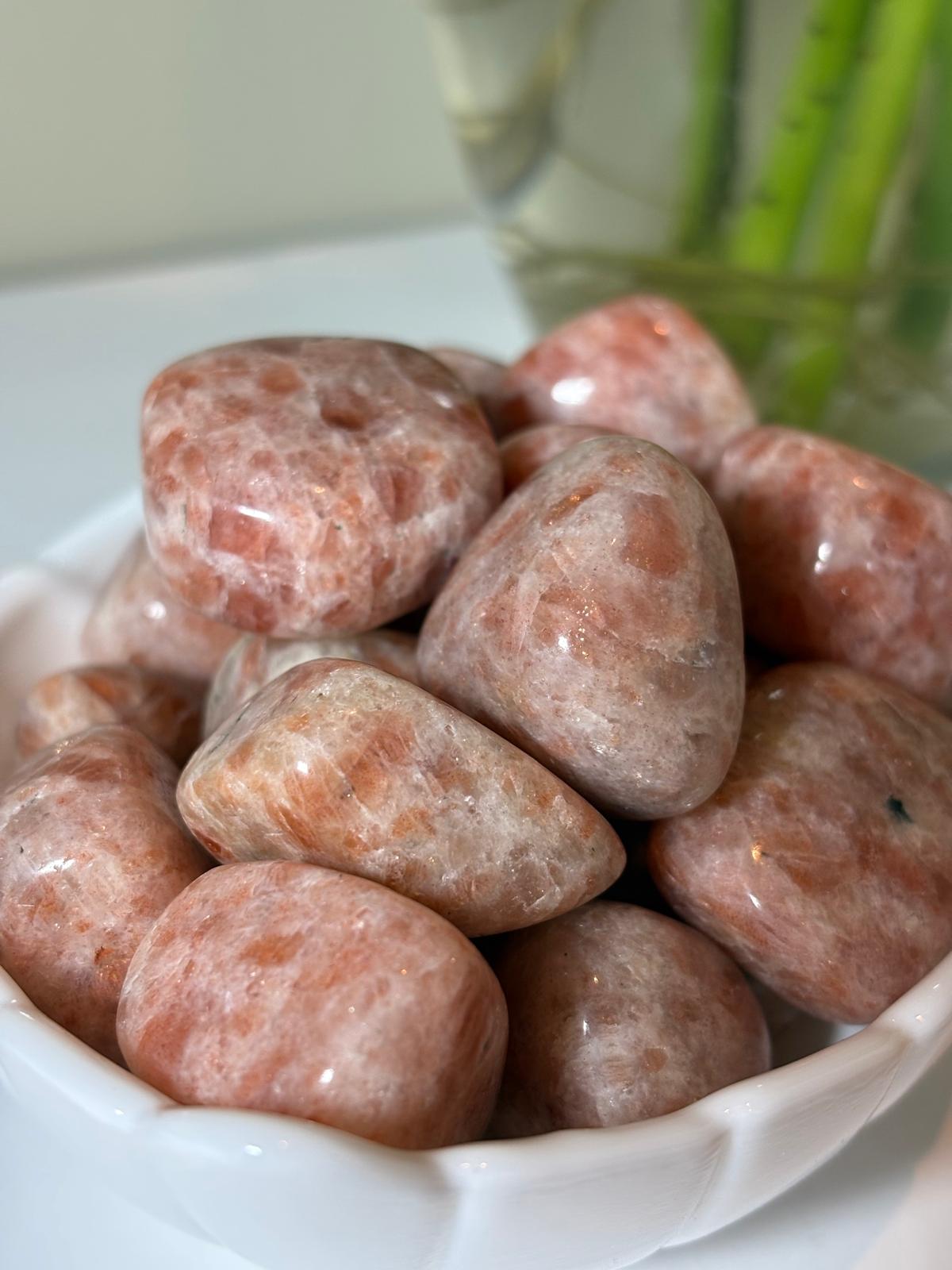 AmazeU amethyst tumbled stone polished smooth in a white bowl with pink and purple hues