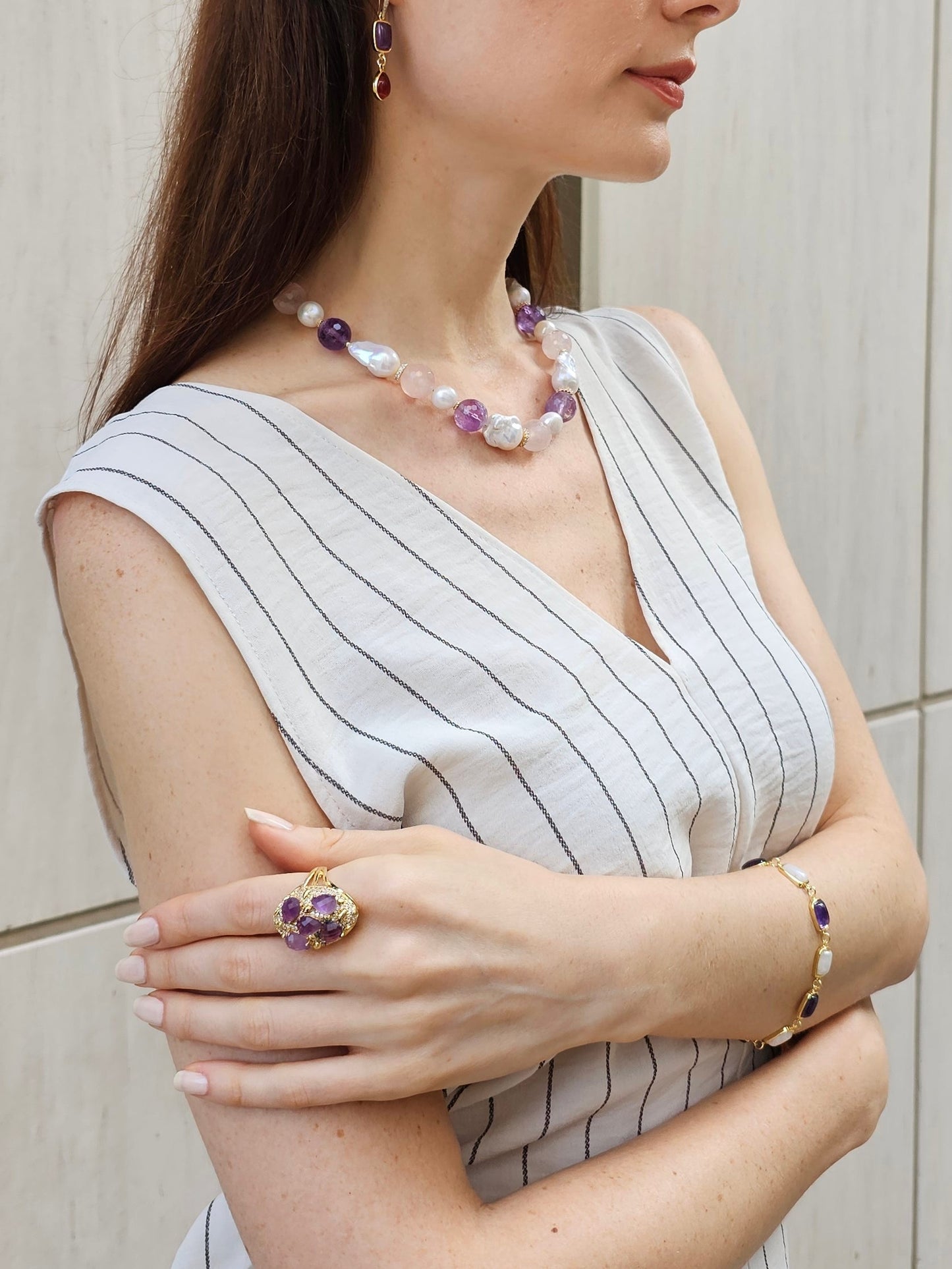 FARRA ring featuring handmade amethyst jewelry worn with matching necklace and bracelet