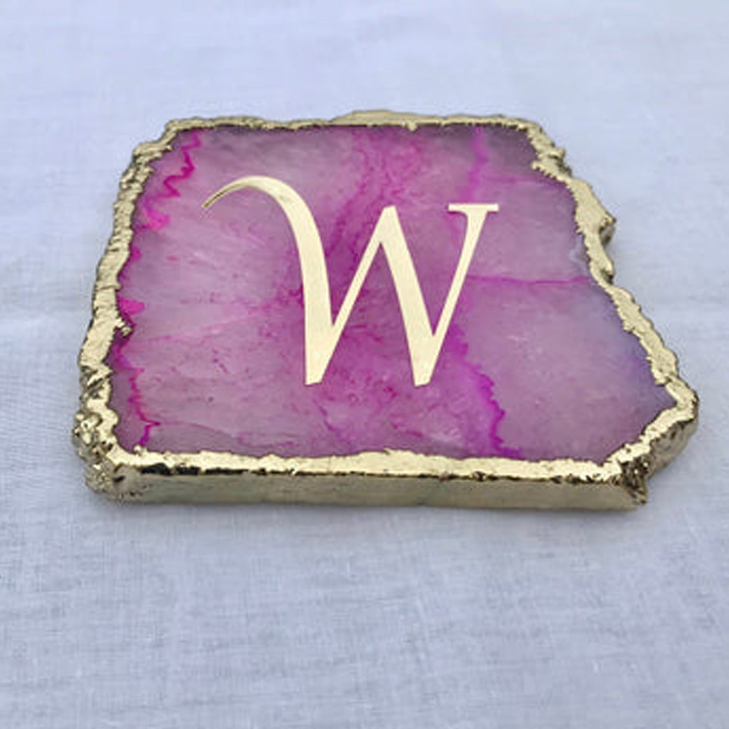 Large pink agate drink coasters with gold edges and letter W monogram from The Tangerine Store