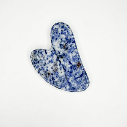 Blue and white natural stone face sculpting tool with smooth curved edges for facial massage