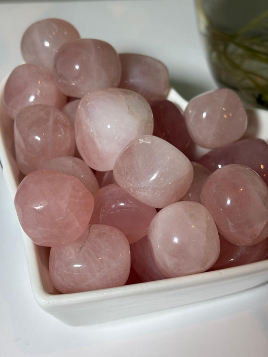 AmazeU natural tumbled rose quartz wholesale stones in a white dish with a smooth pink finish